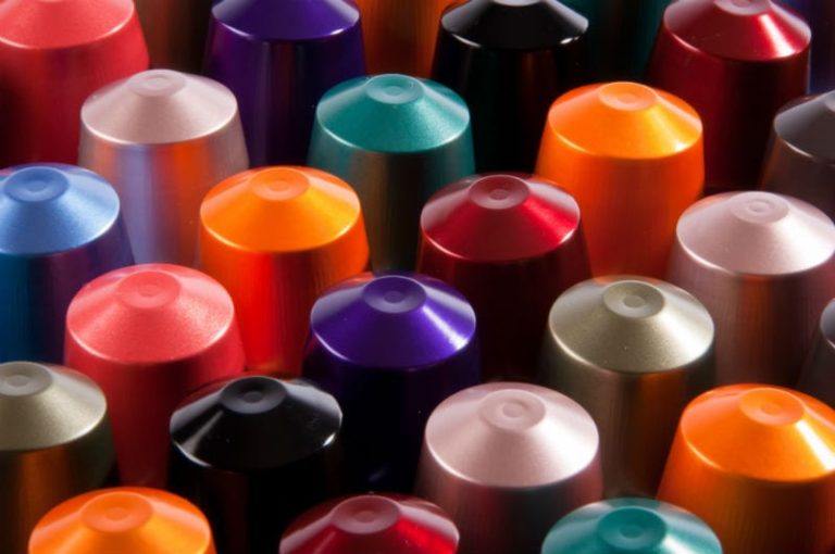 Row of translucent soft gel capsules with orange and yellow hues