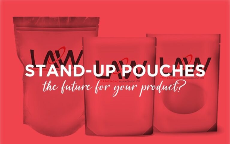 A stand up pouch standing upright on a shelf, showing its flat bottom and flexible design.